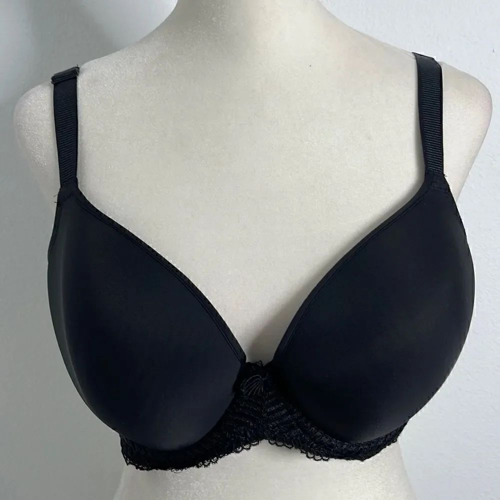 Wacoal silky black underwire bra with mesh and bow embellishments. Size 40C.